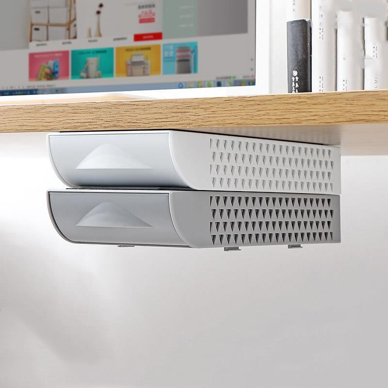 Grey drawers mounted under a desk
