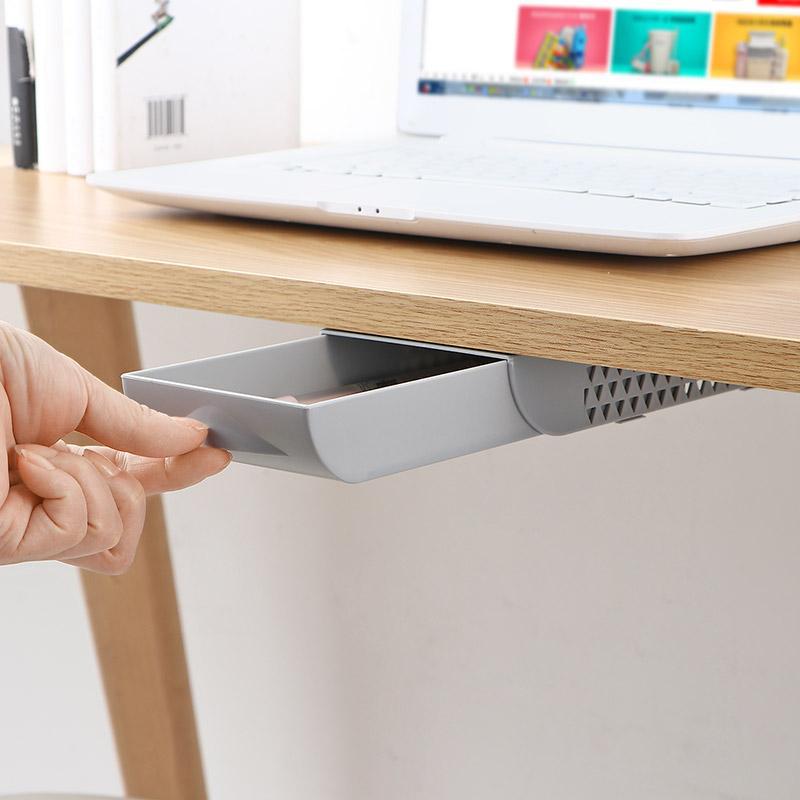 Pulling open an under-desk drawer