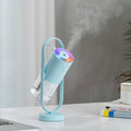 Blue projection humidifier on a desk