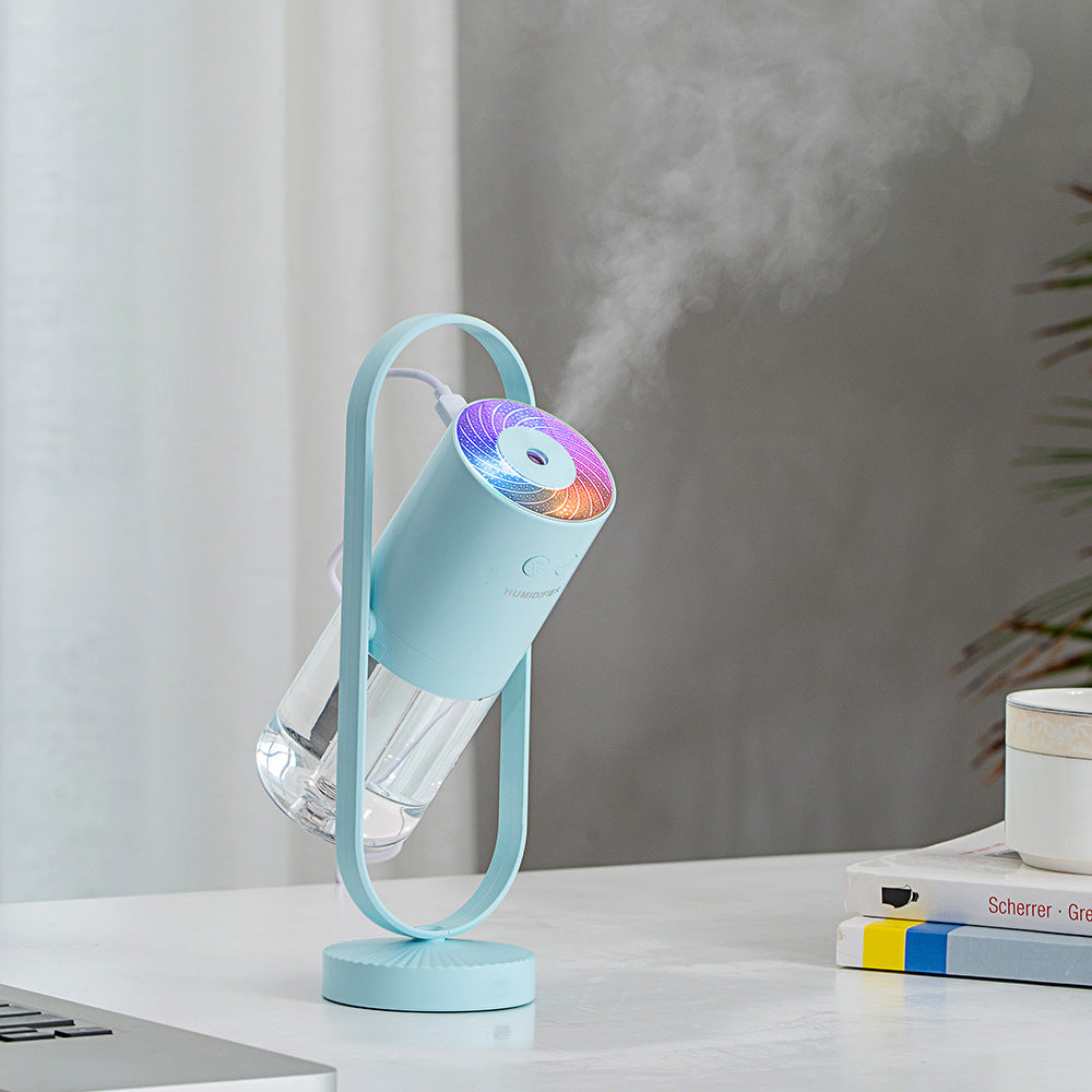 Blue projection humidifier on a desk