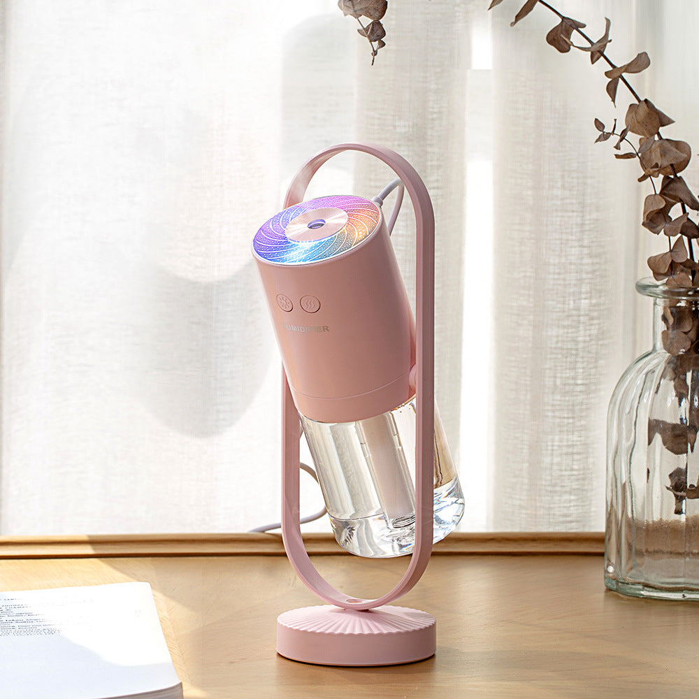 Pink humidifier by a window